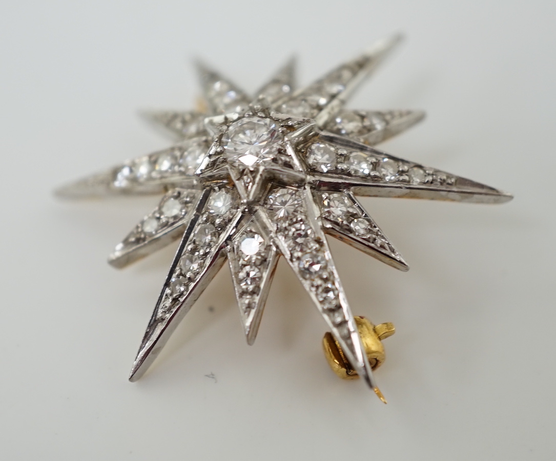 An Edwardian gold and diamond cluster set starburst brooch
